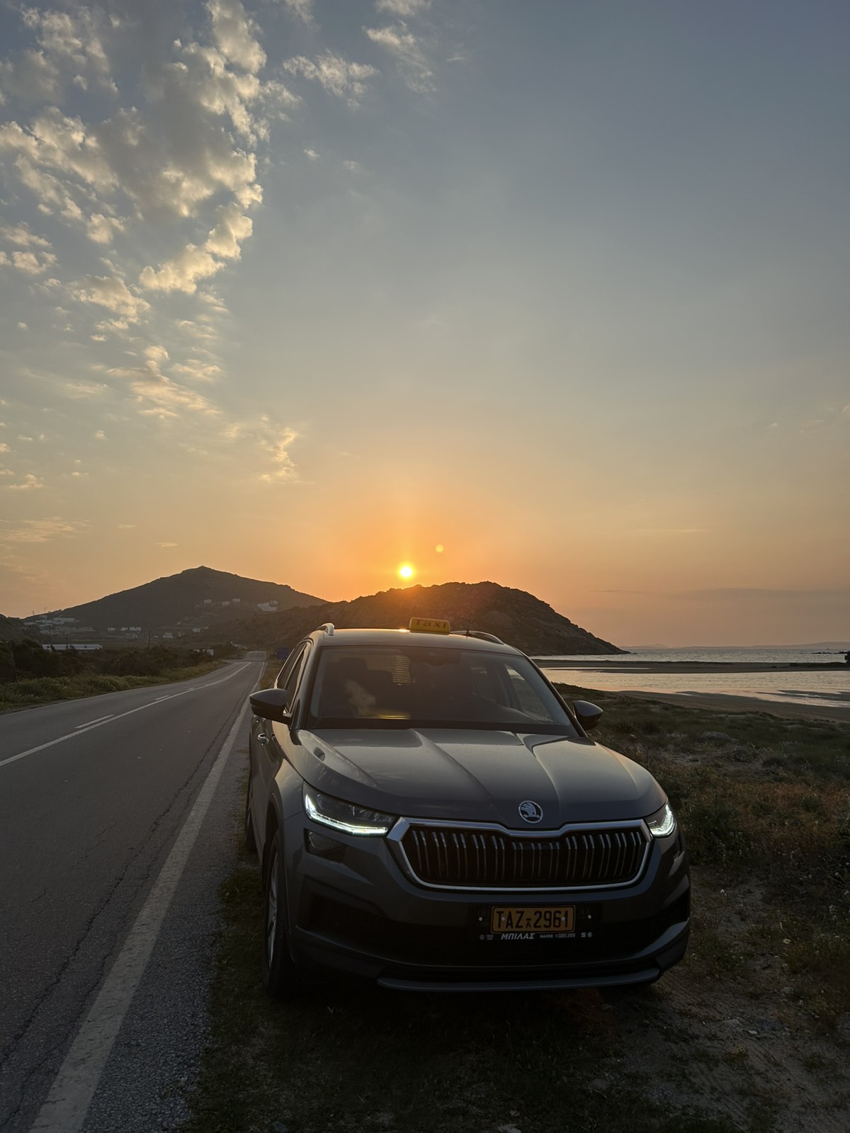 Taxi in Naxos island during sunset – Skoda Kodiaq parked by the sea